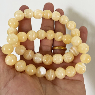 Vòng tay chuỗi hạt ngọc thật màu vàng cam cho người mệnh Thổ và hỏa đường kính hột 10 li (1cm)